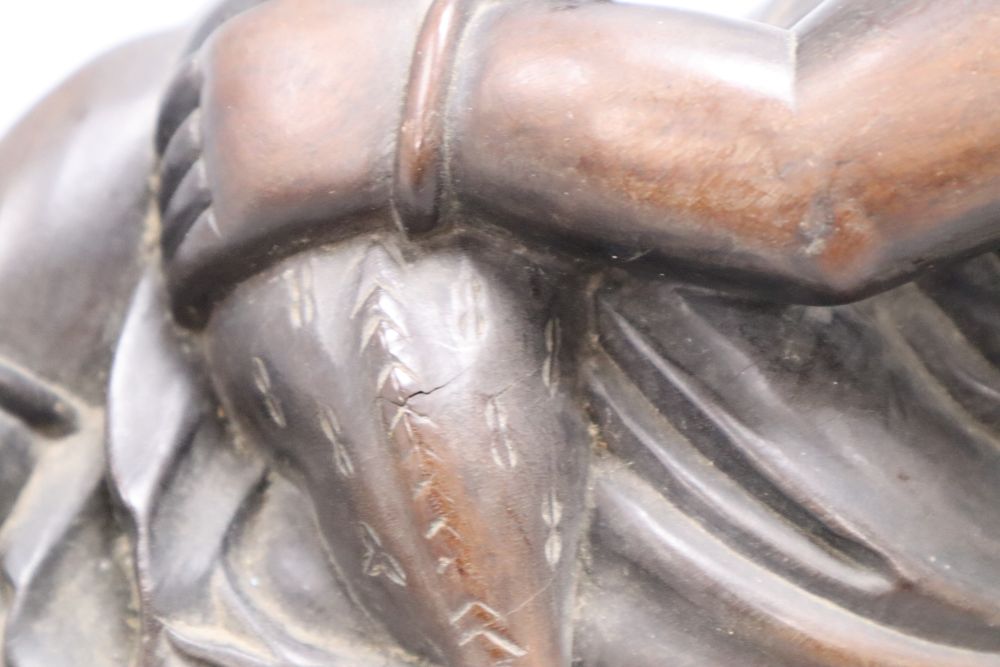 A Chinese hardwood carving of Liu Hai, width 43cm
